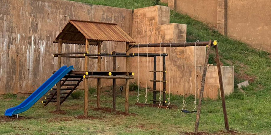 Custom wooden jungle gym built by Durban Poles for a Ballito home